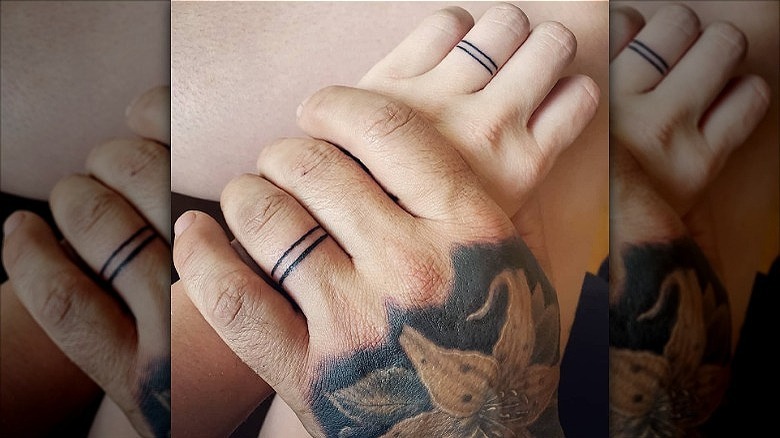 couple wearing double wedding band tattoos
