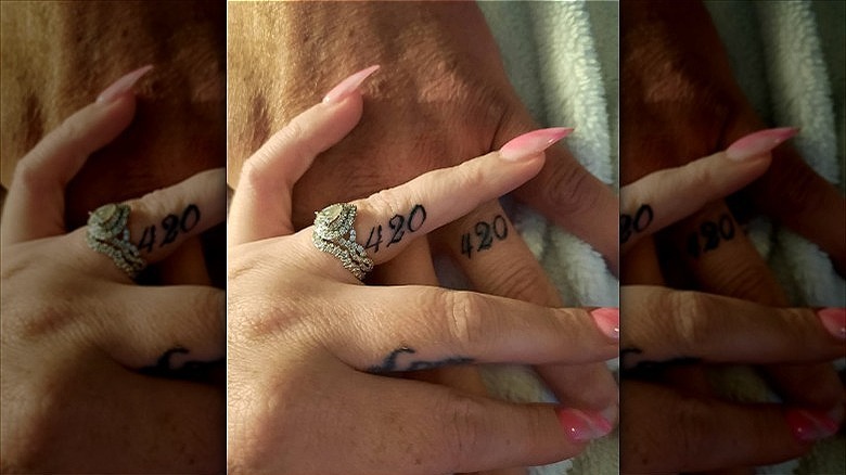 couple wearing anniversary date tattoos