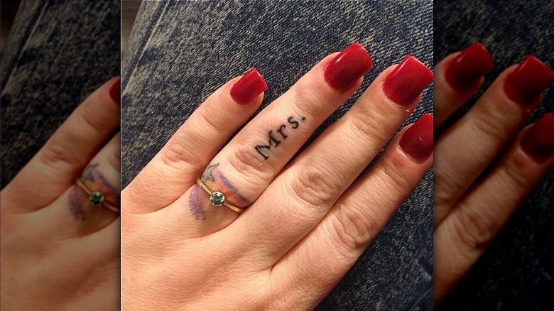 woman with mrs. wedding ring tattoo