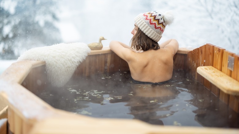 Woman relaxing in a hot tub