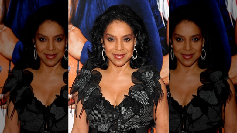Phylicia Rashad poses with a jet-black lob haircut
