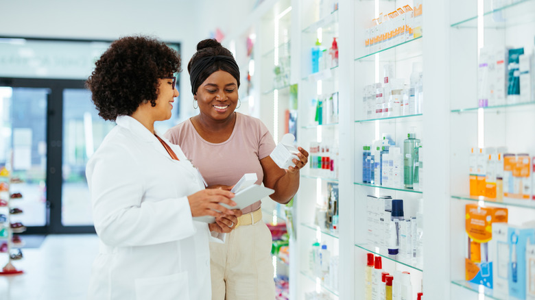 woman looking at medical skincare