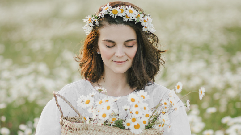 woman with daisies in her hair