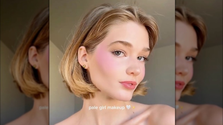 A pale person with blushy cottagecore makeup