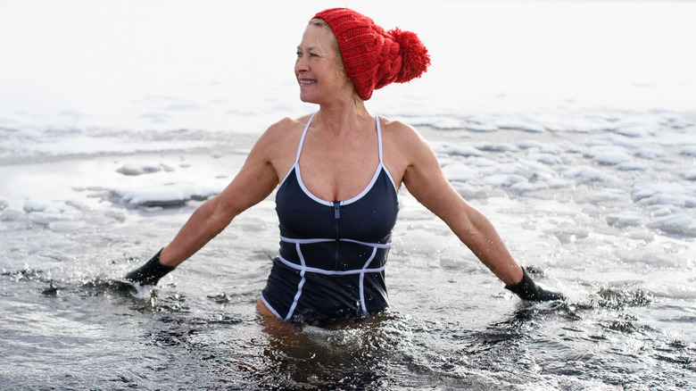 Woman bathes in frozen lake
