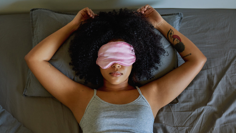 Woman sleeping with eye mask