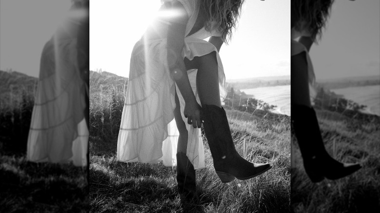 Model in cowboy boots, prairie dress