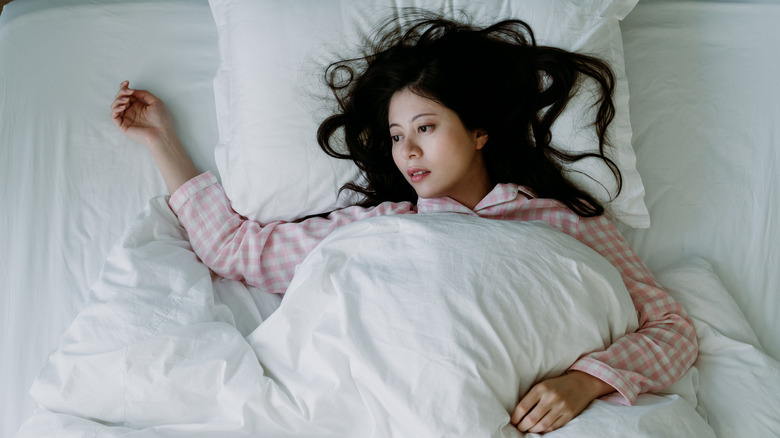 Woman awake in bed