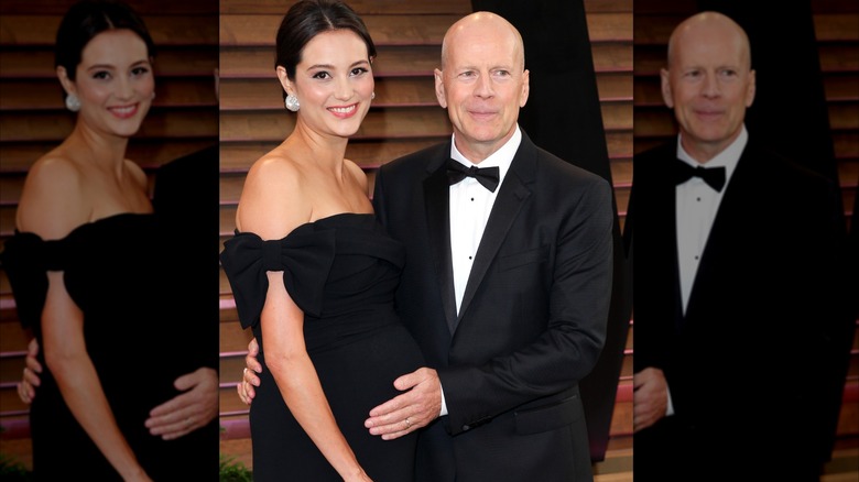 Bruce Willis is seen sweetly cradling his wife Emma Heming's baby bump on the red carpet