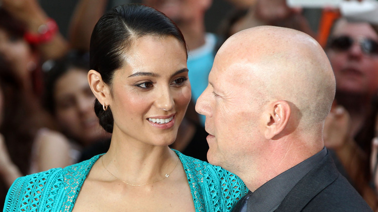Emma Heming Willis and Bruce Willis are seen gazing lovingly into each other's eyes during a red carpet photo-op.