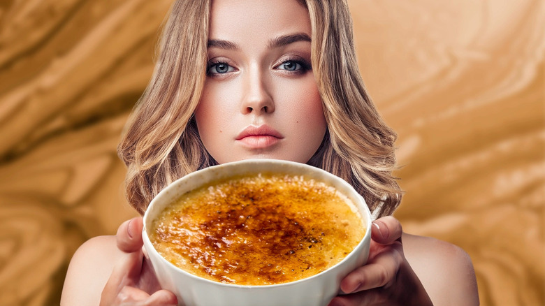 Woman holding crème brûlée 