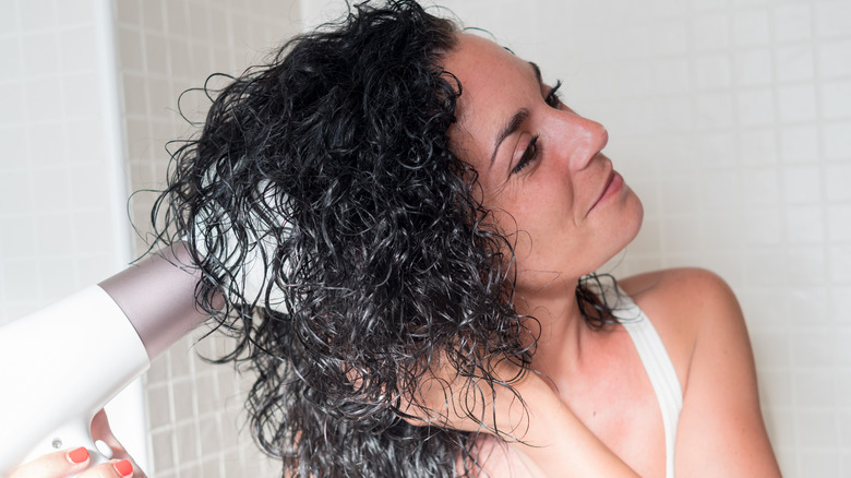 Woman using a difffuser
