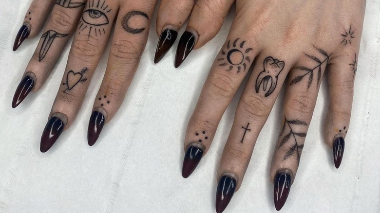 I think my tattoos look pretty nice with black nail polish : r/GothStyle