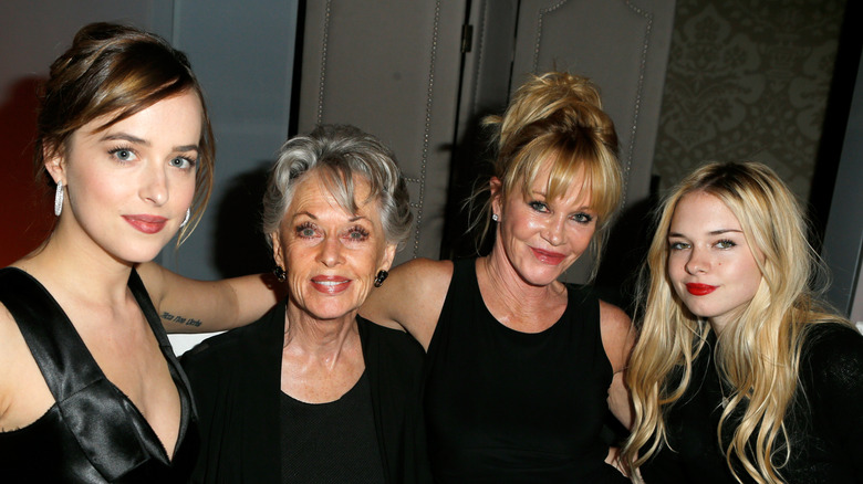 Dakota Johnson, Tippi Hedren, Melanie Griffith, and Stella Banderas smile for a photo