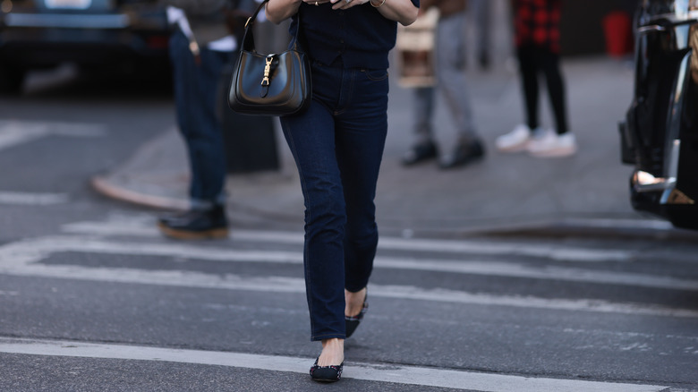 woman in dark jeans