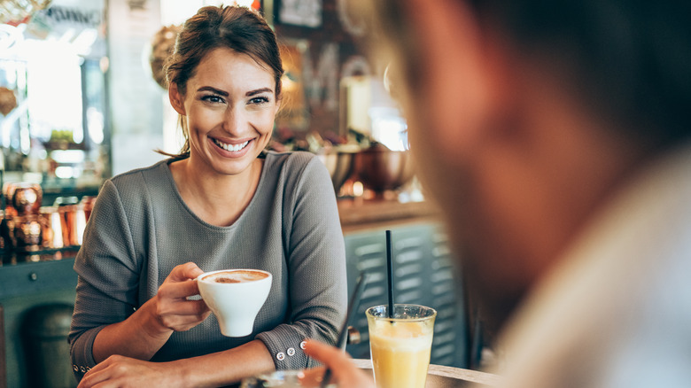 woman with coffee on date