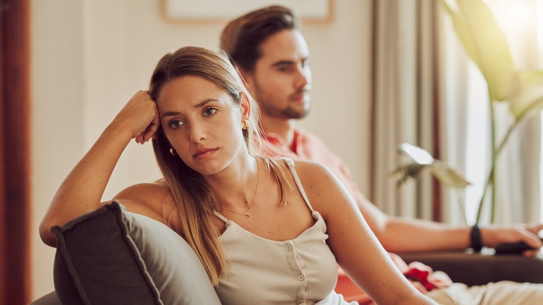 Woman turning back on man 