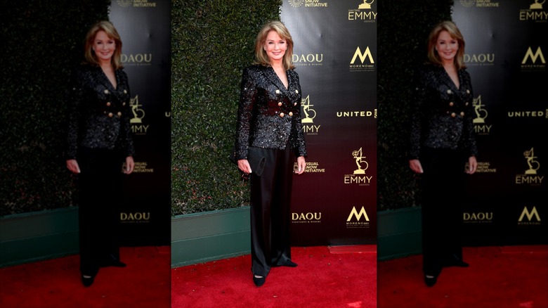 Deidre Hall smiles wearing an encrusted black blazer