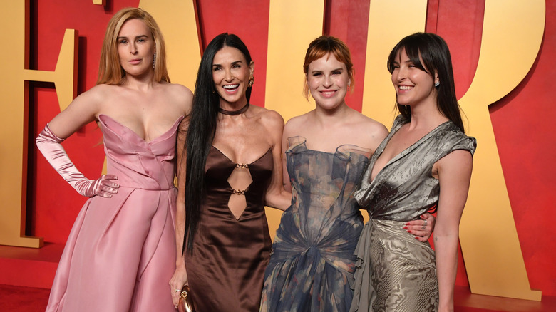 Demi Moore and her daughters on a red carpet