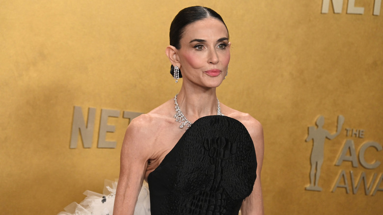 Demi Moore dons a black dress and diamonds on the red carpet