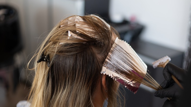 person dyeing hair