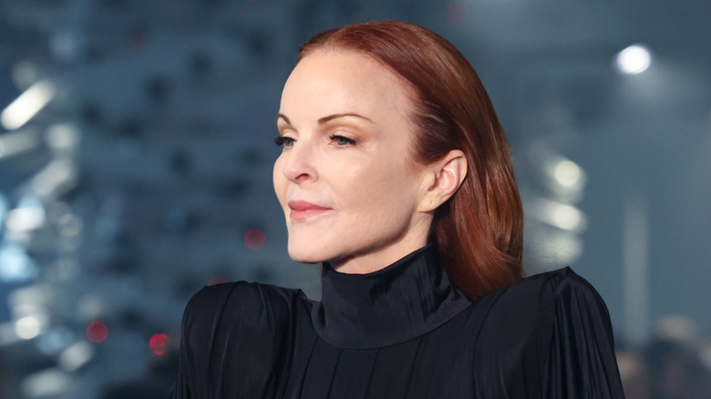 Marcia Cross wears a black dress at the Vetements Fall/Winter 2024 fashion show