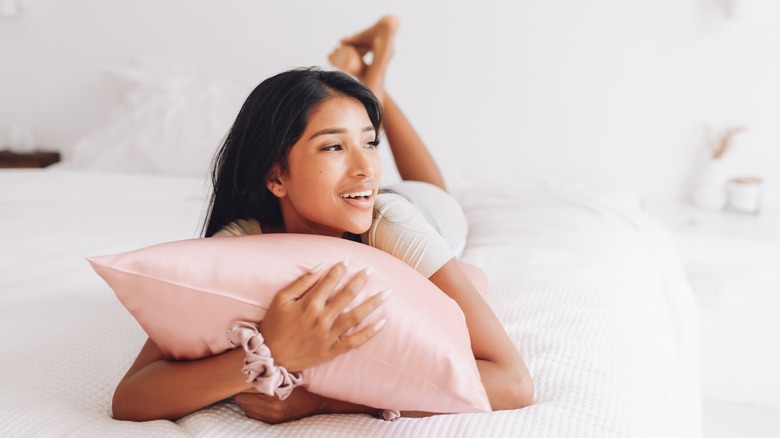 woman laying on pillow