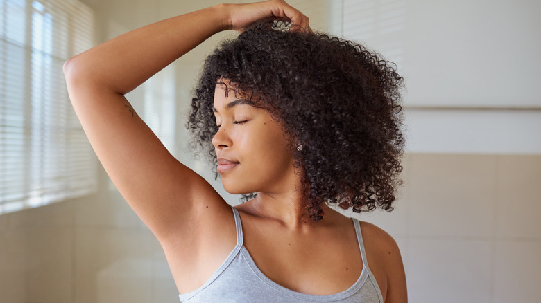 woman with raised arm