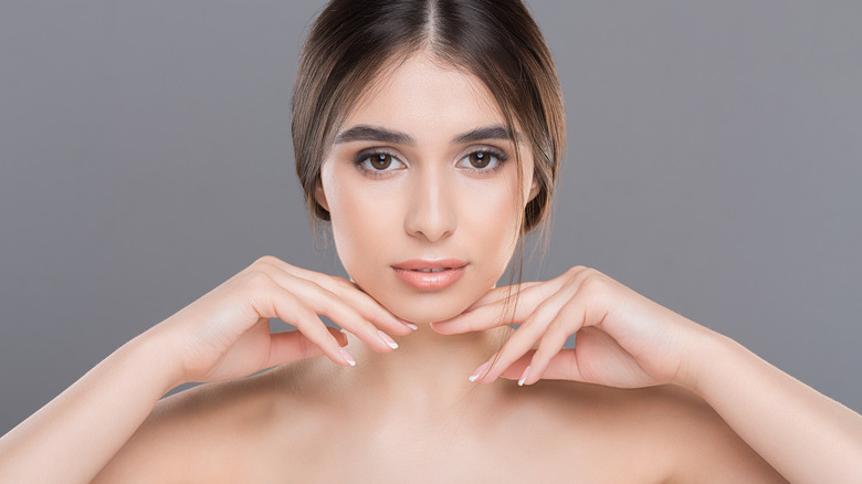 woman posing with chin lifted