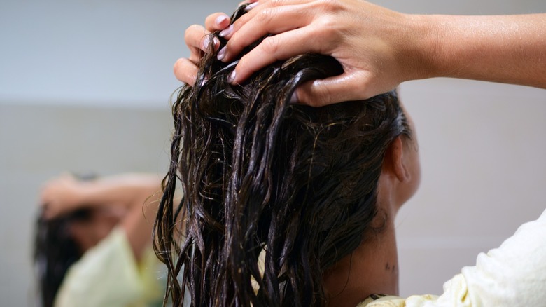 woman getting hair treatment
