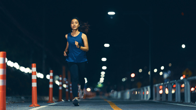 Woman running at night