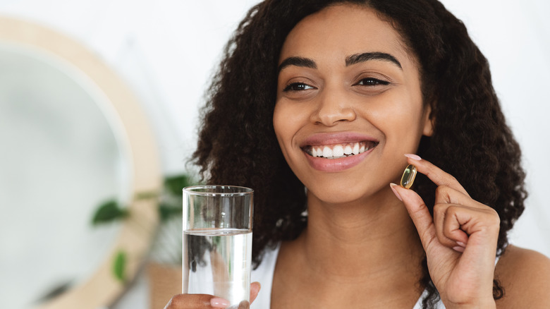 woman taking a vitamin