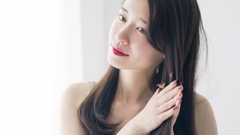 Woman styling her hair