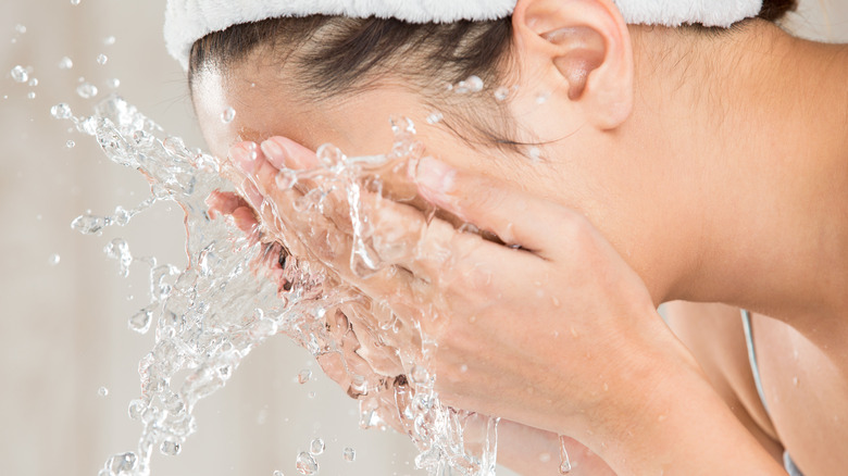 woman washing face