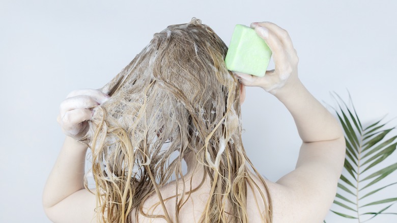 woman shampooing hair 