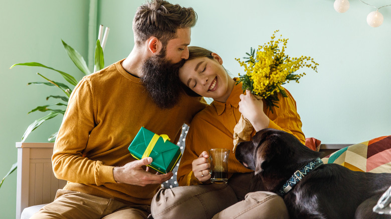 Man giving woman gifts