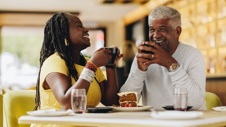 couple laughing over dessert