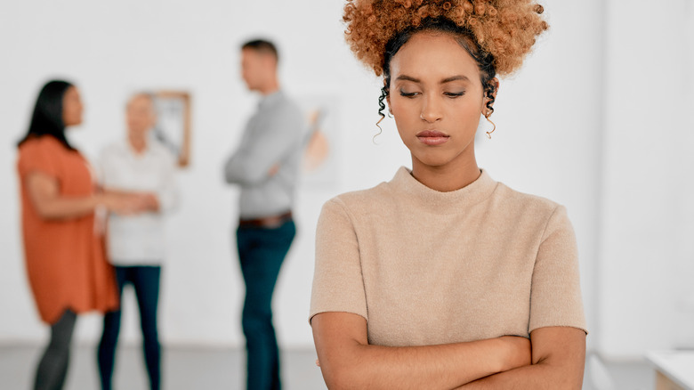 woman feeling rejected by colleagues