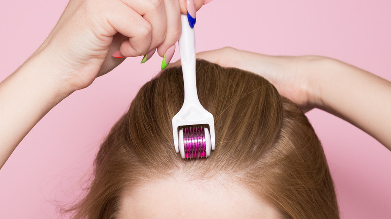 close up of derma rolling for hair 