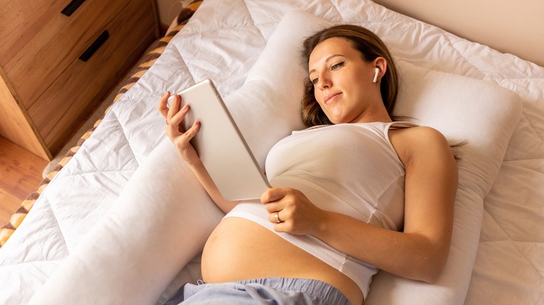 Pregnant woman using iPad