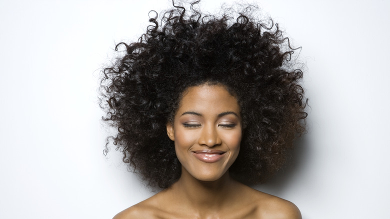 happy woman with curly hair