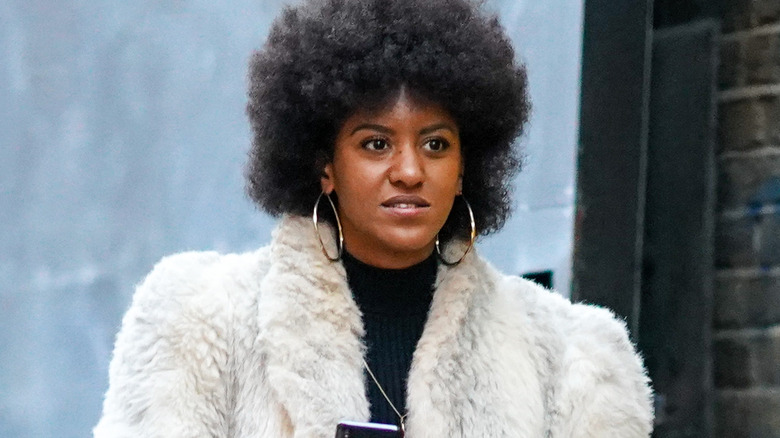 Woman with textured hair walking