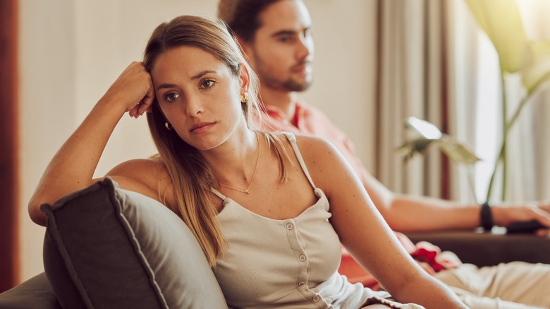 Upset couple on the couch