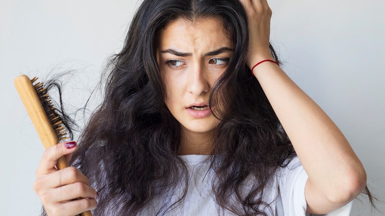 Woman experiencing hair damage