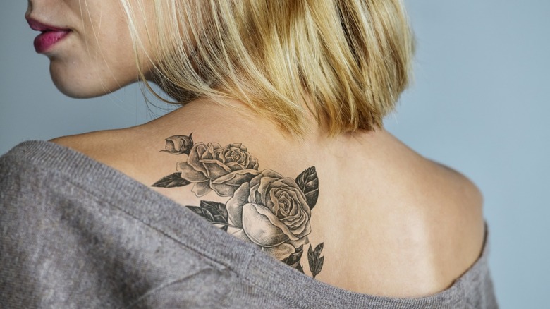 Woman with giant rose tattoo