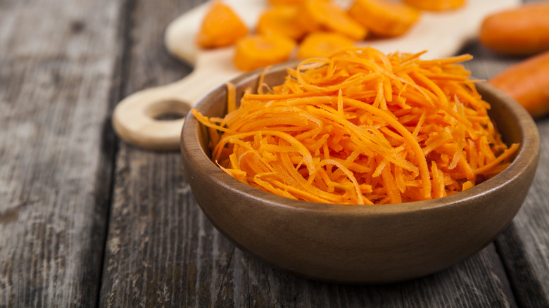 Wood bowl with shredded carrot