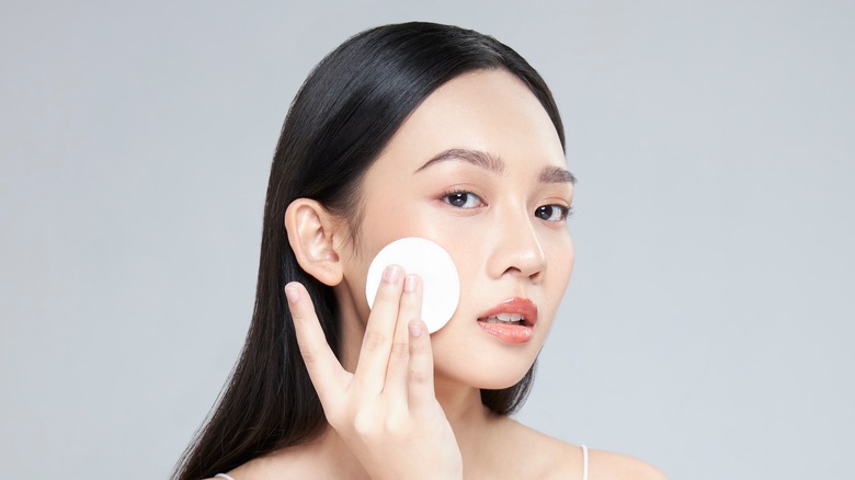 Woman applying toner 