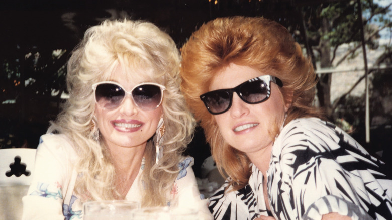 Dolly Parton and Judy Ogle wearing sunglasses