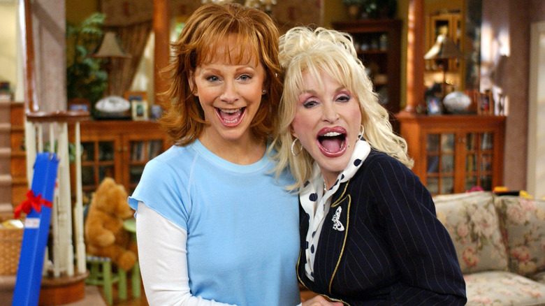 Reba McEntire and Dolly Parton laughing
