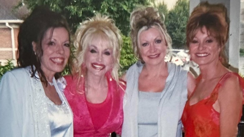 Freida Parton, Dolly Parton, Rachel Parton, and Cassie Parton smiling in a photograph together